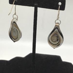 Photo of Brown, creme, and black swirl design earrings