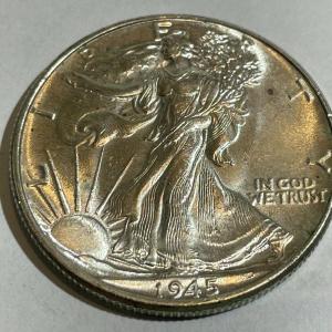 Photo of 1945-P UNCIRCULATED CONDITION WALKING LIBERTY SILVER HALF DOLLAR AS PICTURED.