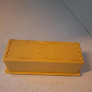 Photo of Yellow tupperware butter