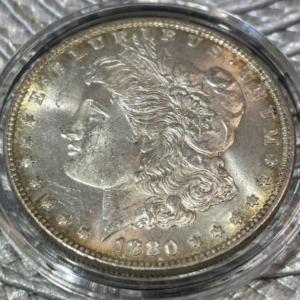 Photo of 1880-P UNCIRCULATED CONDITION MORGAN SILVER DOLLAR AS PICTURED.