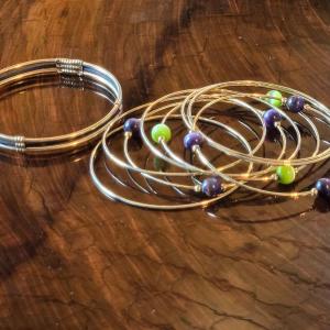 Photo of Gold Tone Bangles with Green & Purple Beads