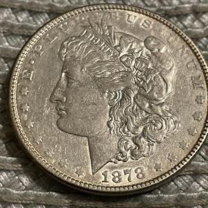 Photo of 1878-P 7TF EXTRA FINE/AU CONDITION CLEANED MORGAN SILVER DOLLAR AS PICTURED.
