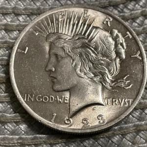 Photo of 1923-P UNCIRCULATED CONDITION PEACE SILVER DOLLAR AS PICTURED.