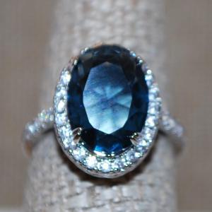Photo of Size 8 Large Blue Green Iridescent Stone Ring with Clear Accent Stones in a "Bas