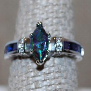 Photo of Size 7½ Marquise Cut Iridescent Blue Stone Ring with Side "Panels" on a .925 Si