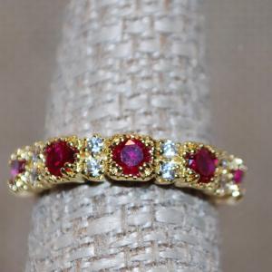 Photo of Size 7 Garnet Style Red Stones Ring with Accent Clear Stones on a .925 Silver Fi