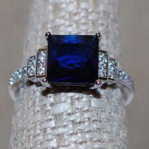 Photo of Size 7 Deep Blue Square Cut Stone Ring with "Side-Steps" Clear Stone Accents on 