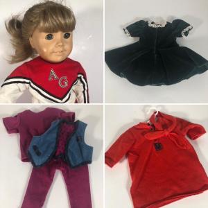 Photo of LOT 59G: American Girl Doll w/ Cheerleader Outfit, Purple Outfit w/ Denim Vest, 