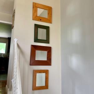 Photo of LOT 112 L: Set of Four Wooden Framed Mirrors