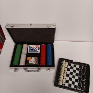 Photo of Poker chips in a metal case and a chess set
