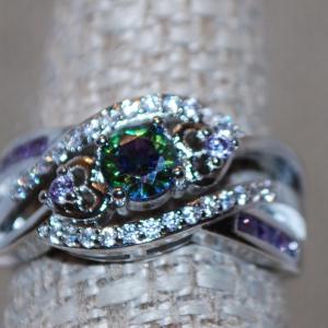Photo of Size 7 Green & Blue Iridescent Round Stone Ring in a Swirl Setting and a .925 Si