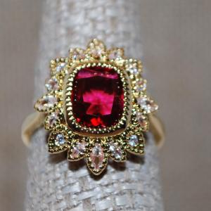 Photo of Size 7¼ Red Cushion Cut Ring in a Crown Style Setting on a Gold Tone Band (4.1g