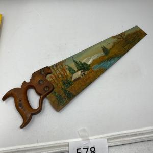 Photo of Antique saw with scene painted