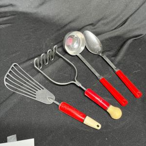 Photo of Vintage red handled utensils