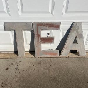 Photo of Three Cast Metal Letters (G-MG)