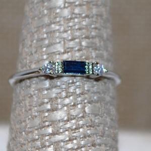 Photo of Size 7 Dainty Blue Rectangle Stone Ring on a Silver Tone Band (1.0g)