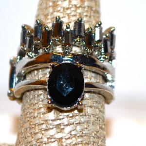 Photo of Size 9 "Crown" Style Ring with Black Oval Main Stone on Expandable Silver Tone B