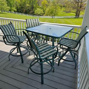 Photo of Tropitone Tall Square Patio Table + Four Swivel Chairs (OP-JS)
