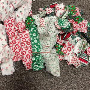 Photo of Lot of Christmas Holiday Print Material cut into stripes and squares, and other 