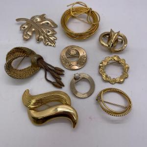 Photo of Lot of Gold toned Pins / Brooches