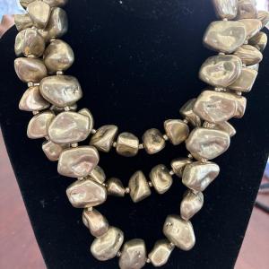 Photo of Women’s fashion statement, necklace, gold toned