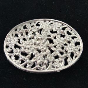 Photo of Silver toned floral belt buckle