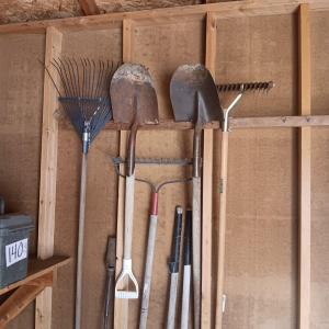 Photo of AN ASSORTMENT OF YARD TOOLS AND A SPREADER