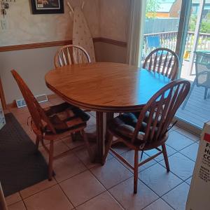 Photo of WOODEN KITCHEN TABLE W/4 CHAIRS AND 2 LEAVES