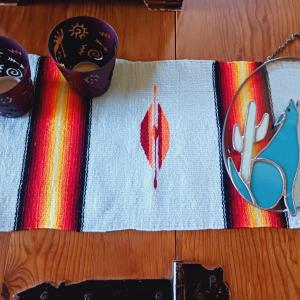 Photo of STAINED GLASS COYOTE, METAL CANDLE HOLDERS AND A WOVEN TABLE RUNNER