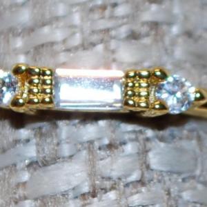 Photo of Size 7 Clear Rectangle Stone Ring with Side Gold Accents on a Gold Tone Band (1.