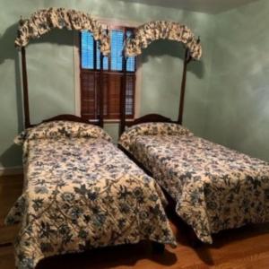 Photo of Two Matching Kittinger Twin Size Mahogany Poster Beds