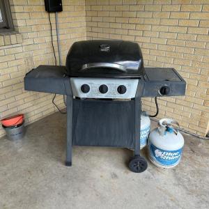 Photo of BACKYARD GRILL 3-BURNER GAS GRILL WITH SIDE BURNER, GRILL BASKETS AND 2 PROPANE 