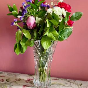 Photo of Artificial Flowers in Cut Crystal Vase