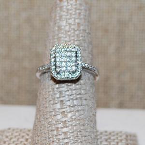 Photo of Size 7¼ Cluster Stones on a Rectangular Basket Style Ring on a Silver Tone Band