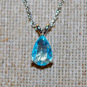 Photo of Robin's Egg Blue Pear Shaped Single Stone Double Hooked PENDANT (½" x ¼") on a