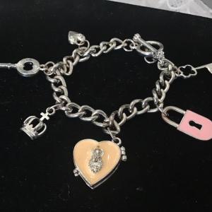 Photo of Silver toned key and lock charm bracelet