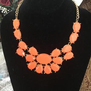 Photo of Coral colored gems on GT necklace