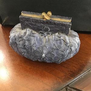 Photo of Vintage crafted coin purse design blue decor
