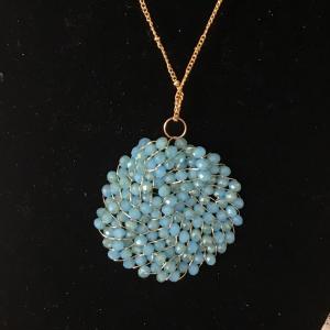 Photo of Beaded circle disc on long GT necklace