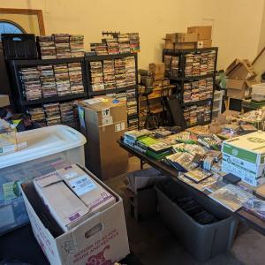 Photo of Garage sale with a lot of media & household goods DVDs CDs Video Games