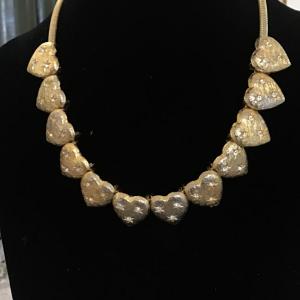 Photo of Gold toned heart necklace
