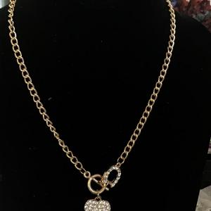 Photo of Gold, toned heart and horseshoe toggle necklace