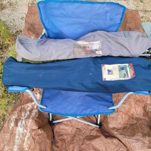 Photo of 3 camp chairs, two with a bag, one without