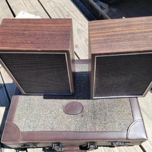Photo of Vintage locking leather briefcase and speakers