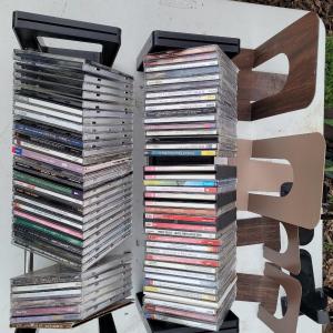 Photo of Lot of cds, cd holders, and bookends cd ends