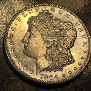 Photo of 1904-O BU CONDITION PROOF LIKE MORGAN SILVER DOLLAR AS PICTURED.