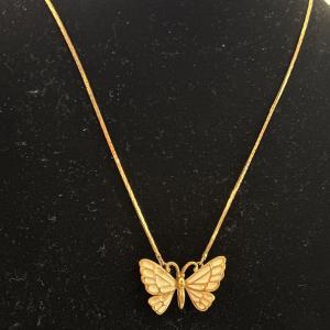 Photo of Beautiful, gold, toned, butterfly necklace