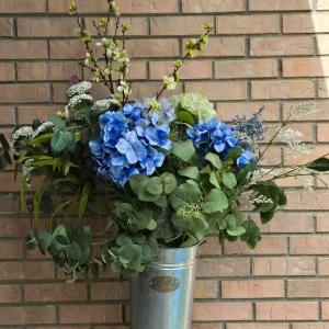Photo of Metal Flower Bucket with Faux Flower Arrangement