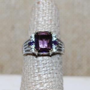 Photo of Size 7 Deep Purple Cushion Cut Center Stone Ring with Clear Accents on a Silver 