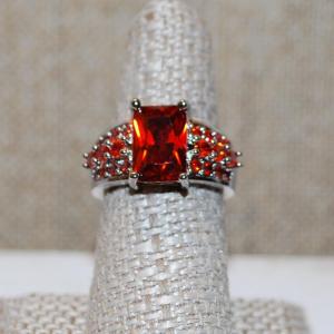 Photo of Size 7¾ Deep Red Emerald Cut Center Stone Ring and Red Accents Stone on a .925 